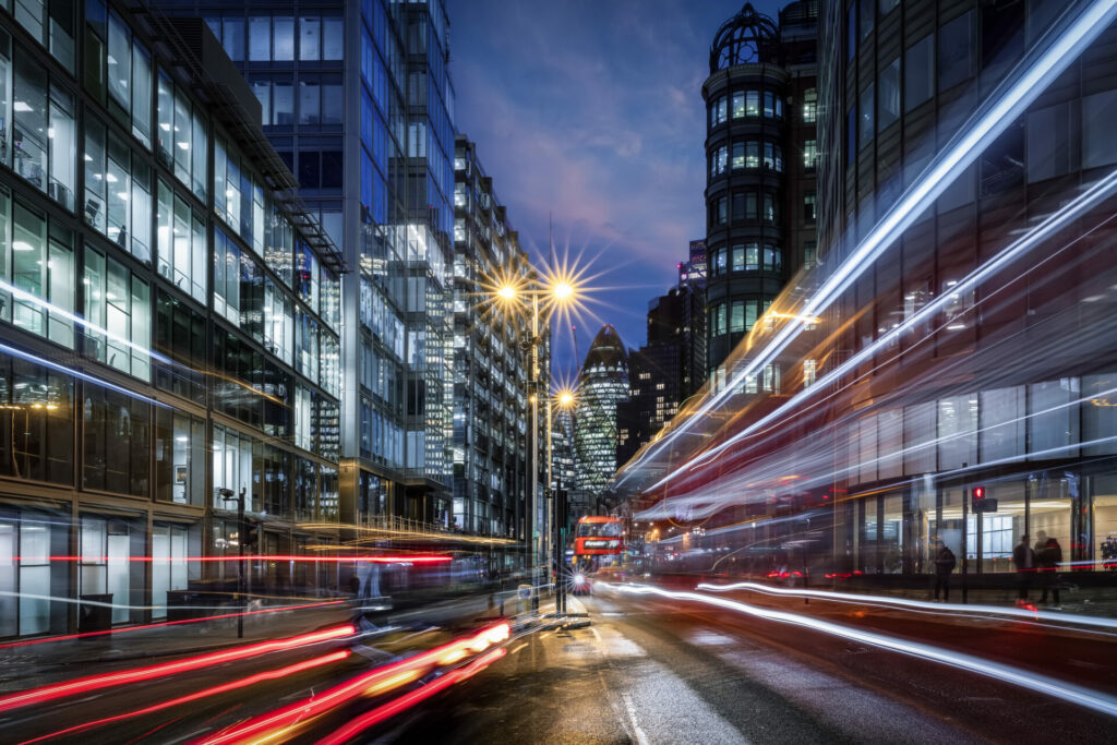 Evening view of a busy road in the City of London with traffic