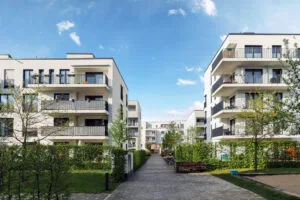 Cityscape of a residential area with modern apartment buildings, representing property management