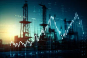 Oil price increase concept with double exposure of digital screen with financial chart graphs and oil pumps on background