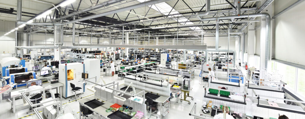 manufacturing plant with machinery and people at work