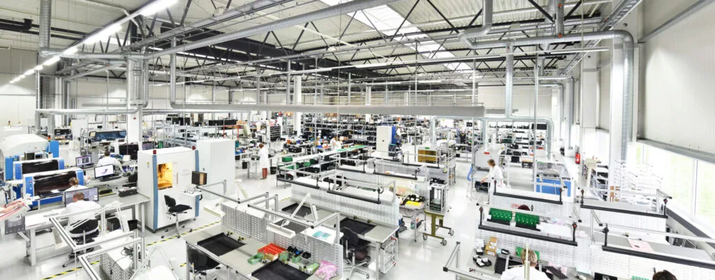 manufacturing plant with machinery and people at work