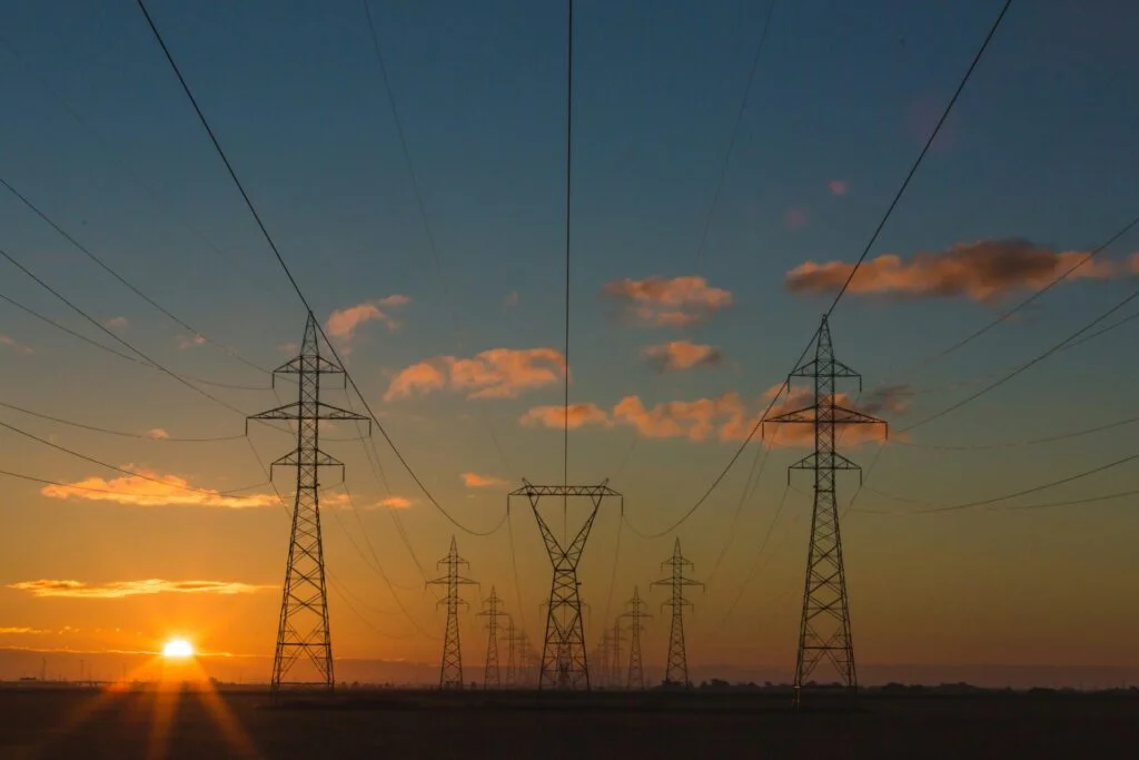 power lines from electricity grid at sunset