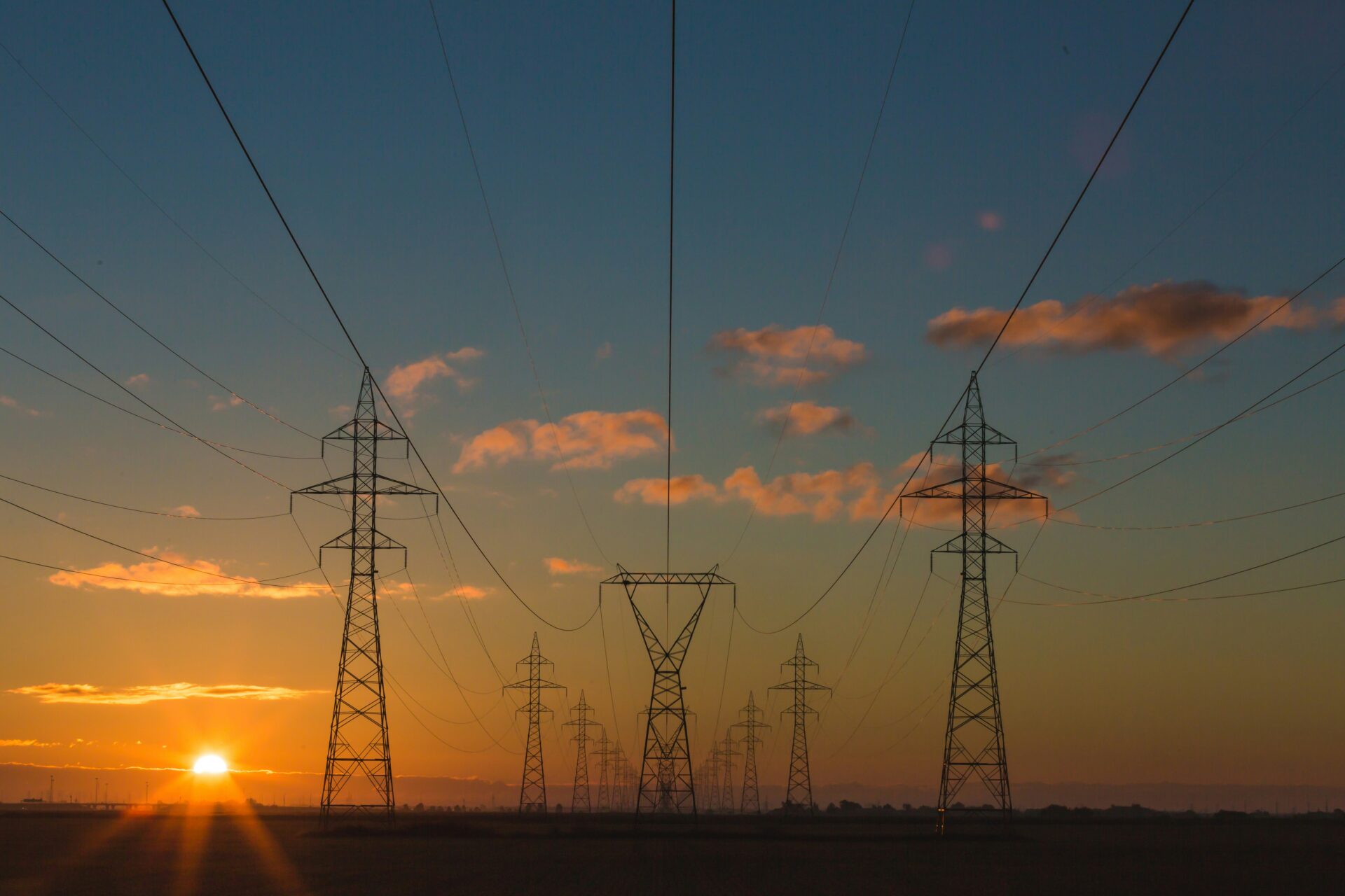 power lines from electricity grid at sunset