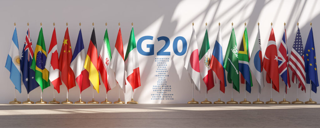 G20 summit on white wall with attending countries flags