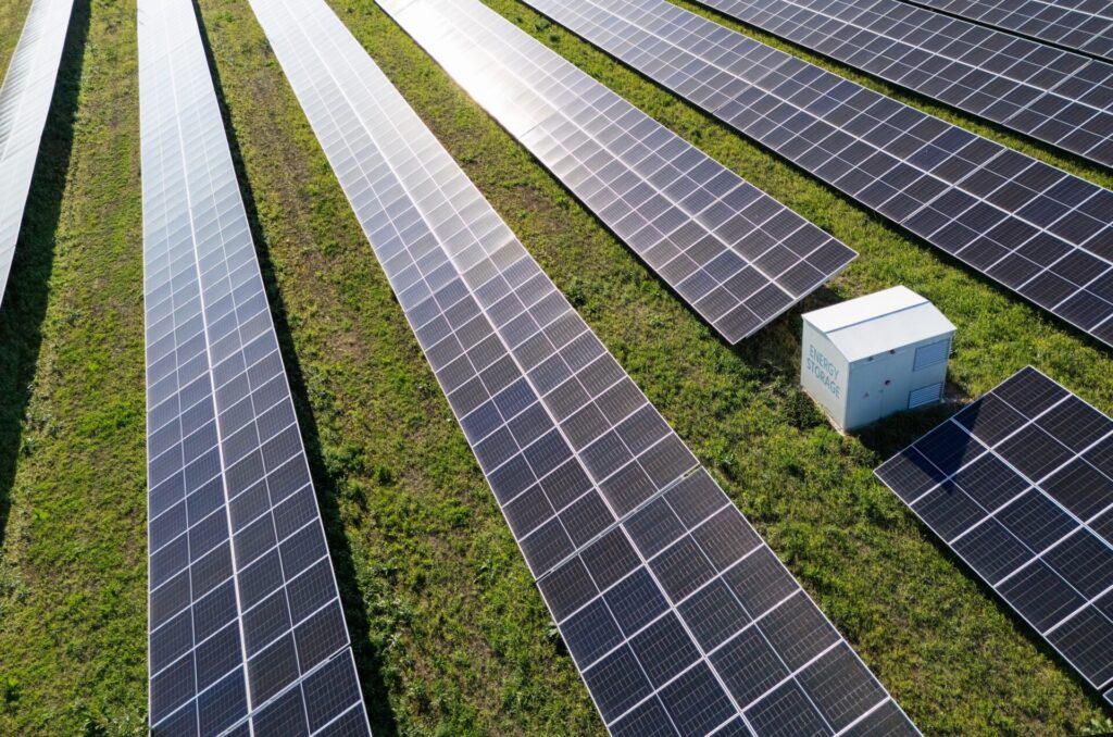 Aerial view of solar power station with energy storage representing co-location
