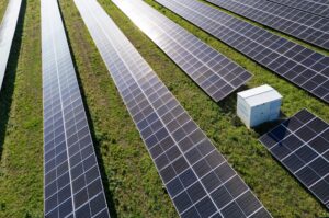 Aerial view of solar power station with energy storage representing co-location