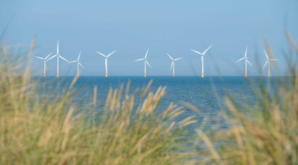 Scroby Sands Wind Farm located in the North Sea off Norfolk coast in the distance.