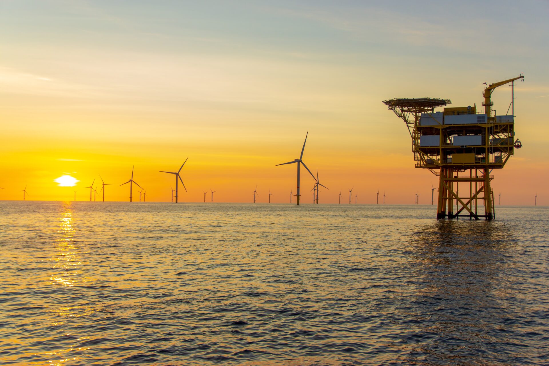 sunset at the North Sea offshore wind farm representing windfall tax