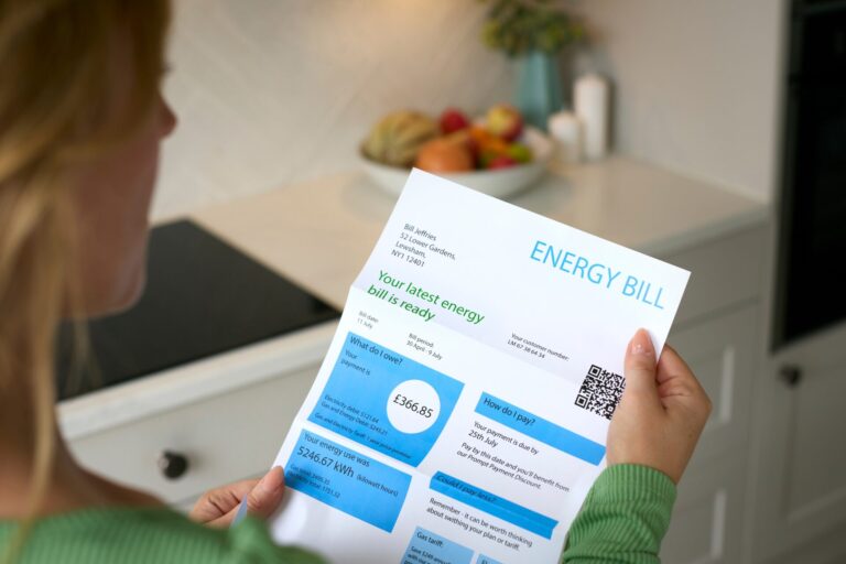 Close Up Of Woman Opening UK Energy Bills
