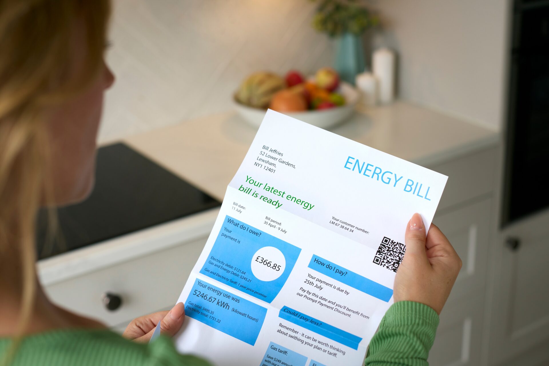 Close Up Of Woman Opening UK Energy Bills
