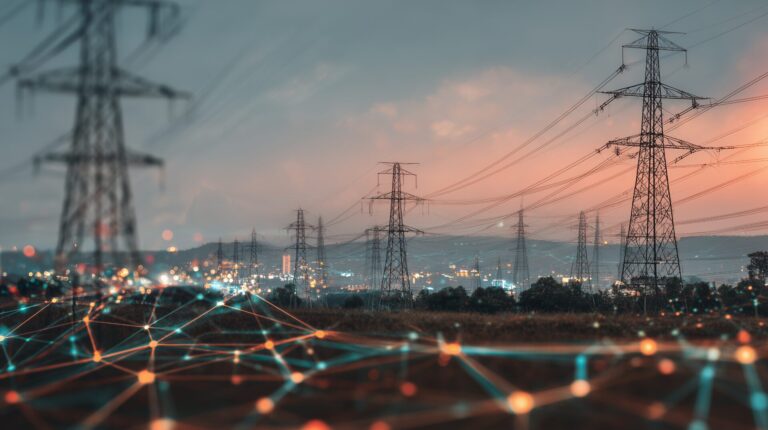 transmission towers against dusk representing network charges