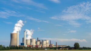 nuclear power plant against blue sky representing SMRs