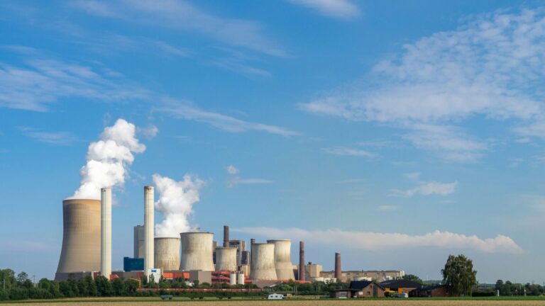 nuclear power plant against blue sky representing SMRs